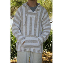 Front view of a man wearing the beige and white mexican baja hoodie