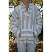 Woman wearing the beige and white stripe baja hoodie