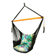 Side view of black hammock chair styled with cushions.