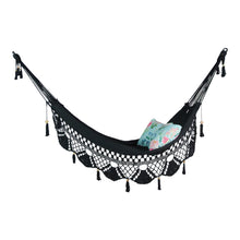 ondi black hammock with tassels styled with cushions