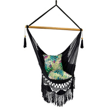 Side view of the byron black hammock chair styled with cushions