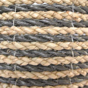 Close up view of the hand woven mixed small black basket with natural and black stripes