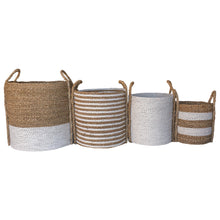 Set of four side by side mixed white large baskets